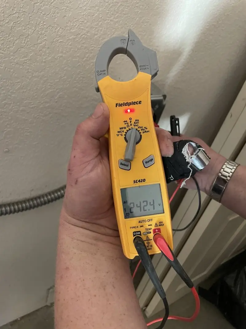 Voltage testing with clamp meter during Recessed Lighting Installation in Ottumwa